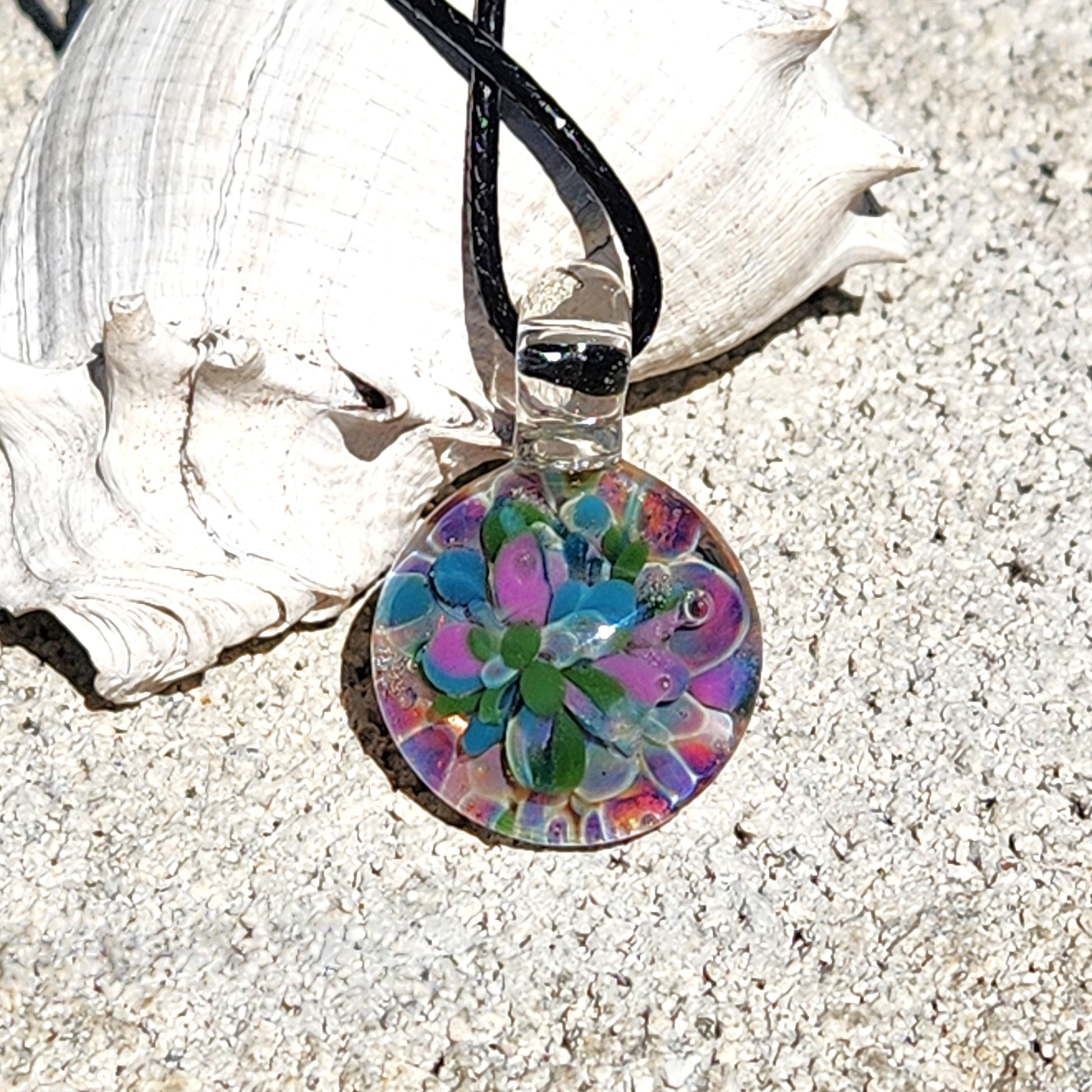 Small purple blue glass pendant with floral design