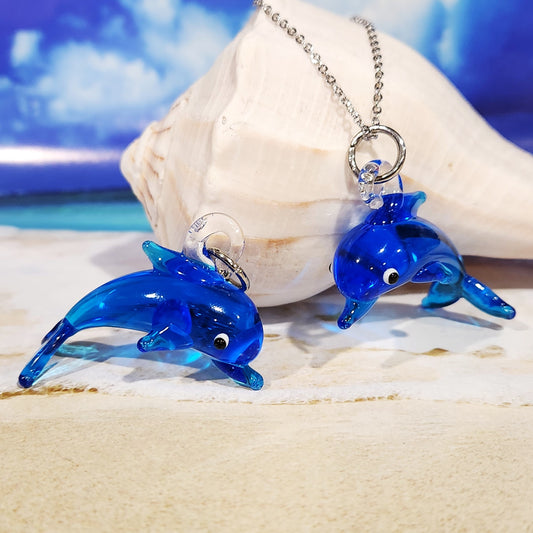 Blue dolphin glass pendant necklace on seashell