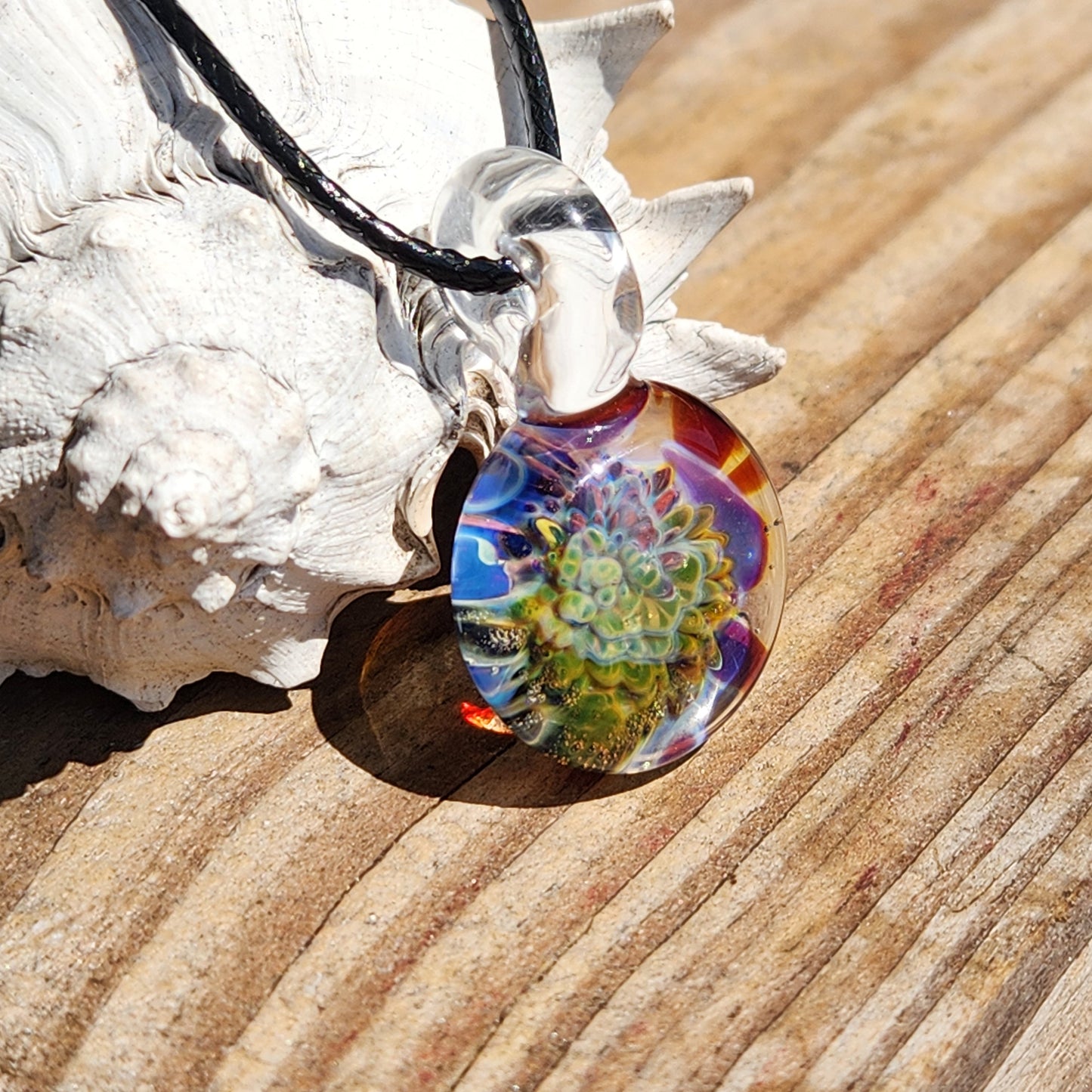 Handmade glass pendant necklace with vibrant floral design