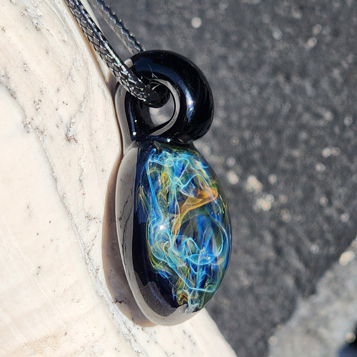 Gold & Silver Fumed Glass Pendant on Deep Blue Background