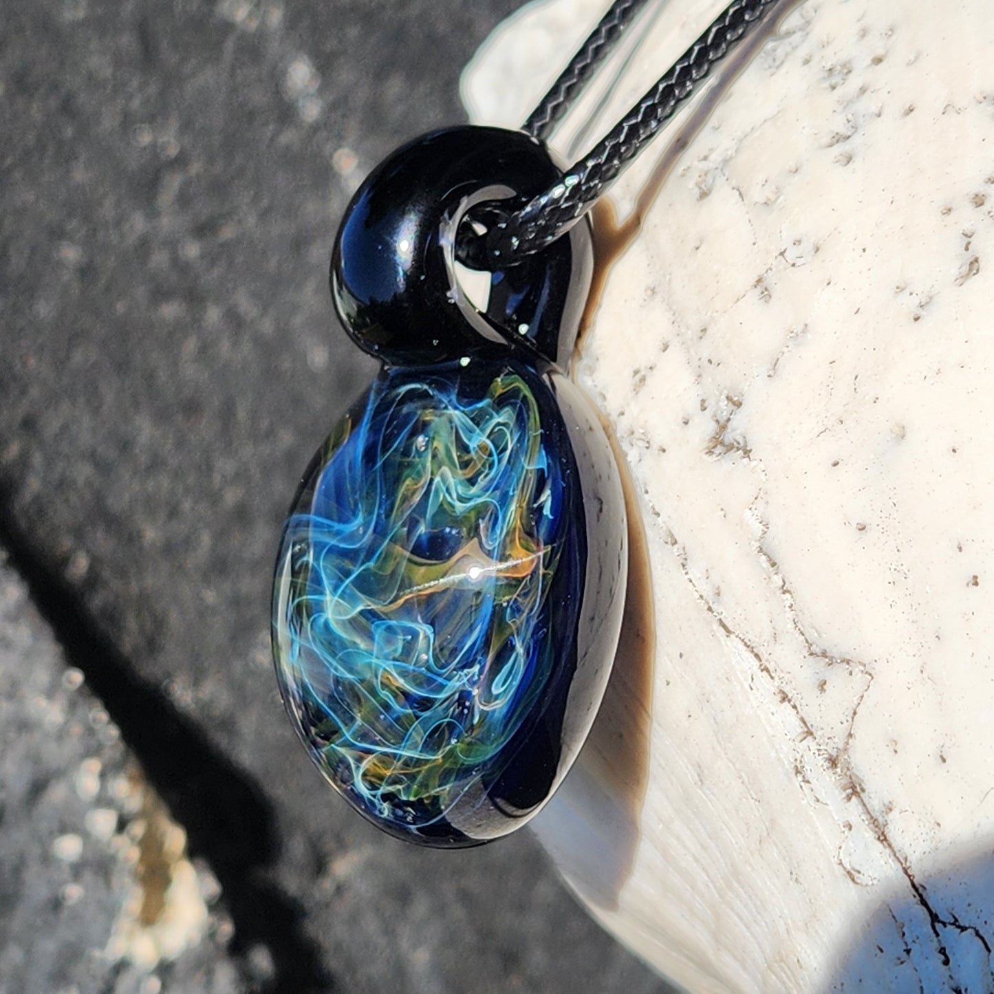 Gold & Silver Fumed Glass Pendant on Deep Blue Background