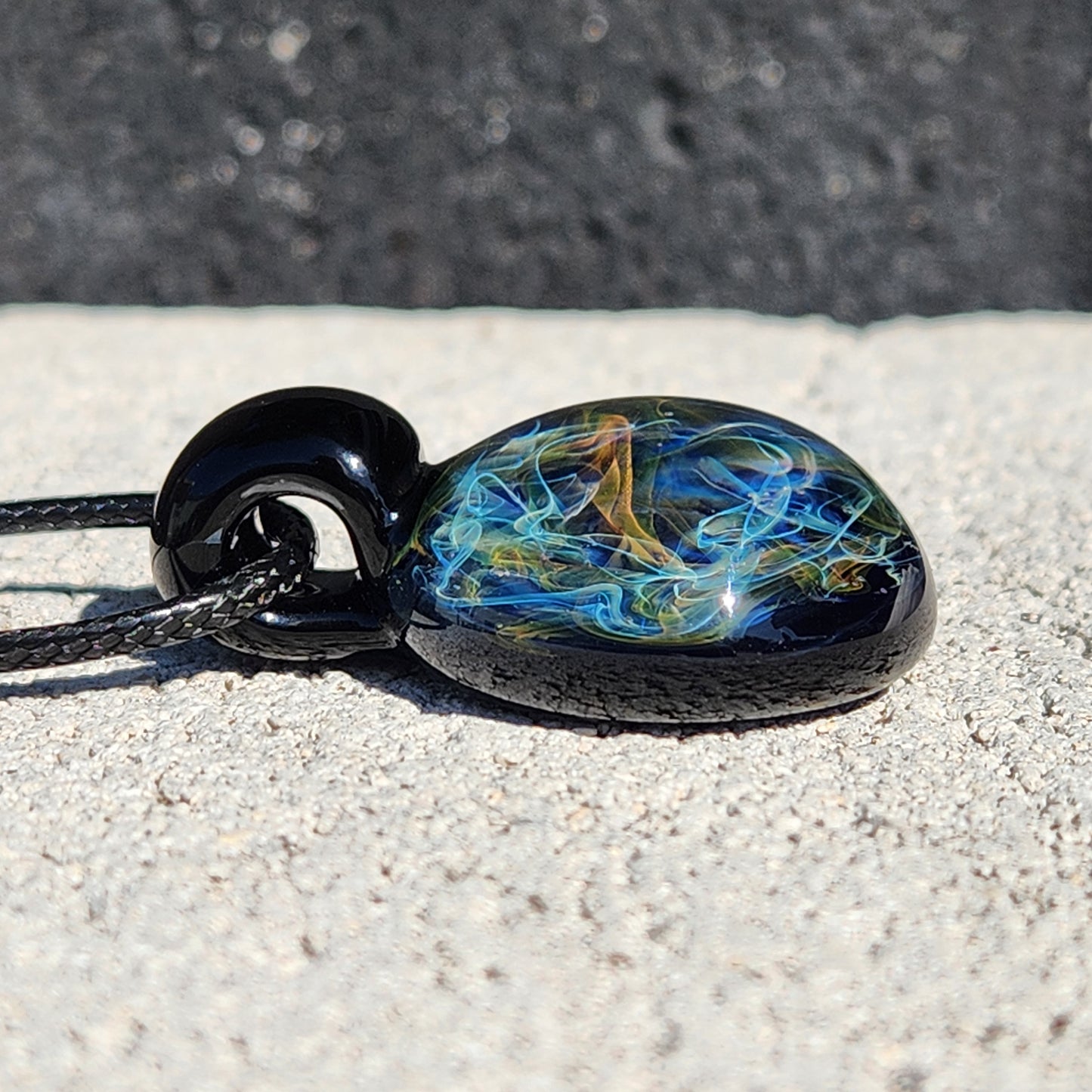 Gold & Silver Fumed Glass Pendant on Deep Blue Background