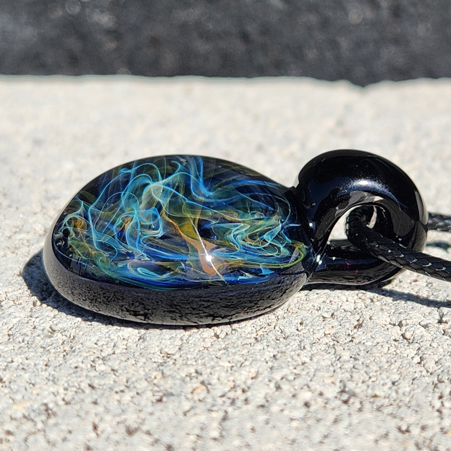Gold & Silver Fumed Glass Pendant on Deep Blue Background
