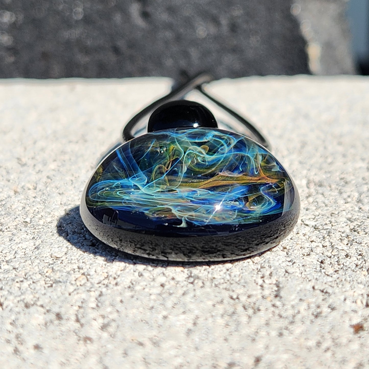 Gold & Silver Fumed Glass Pendant on Deep Blue Background