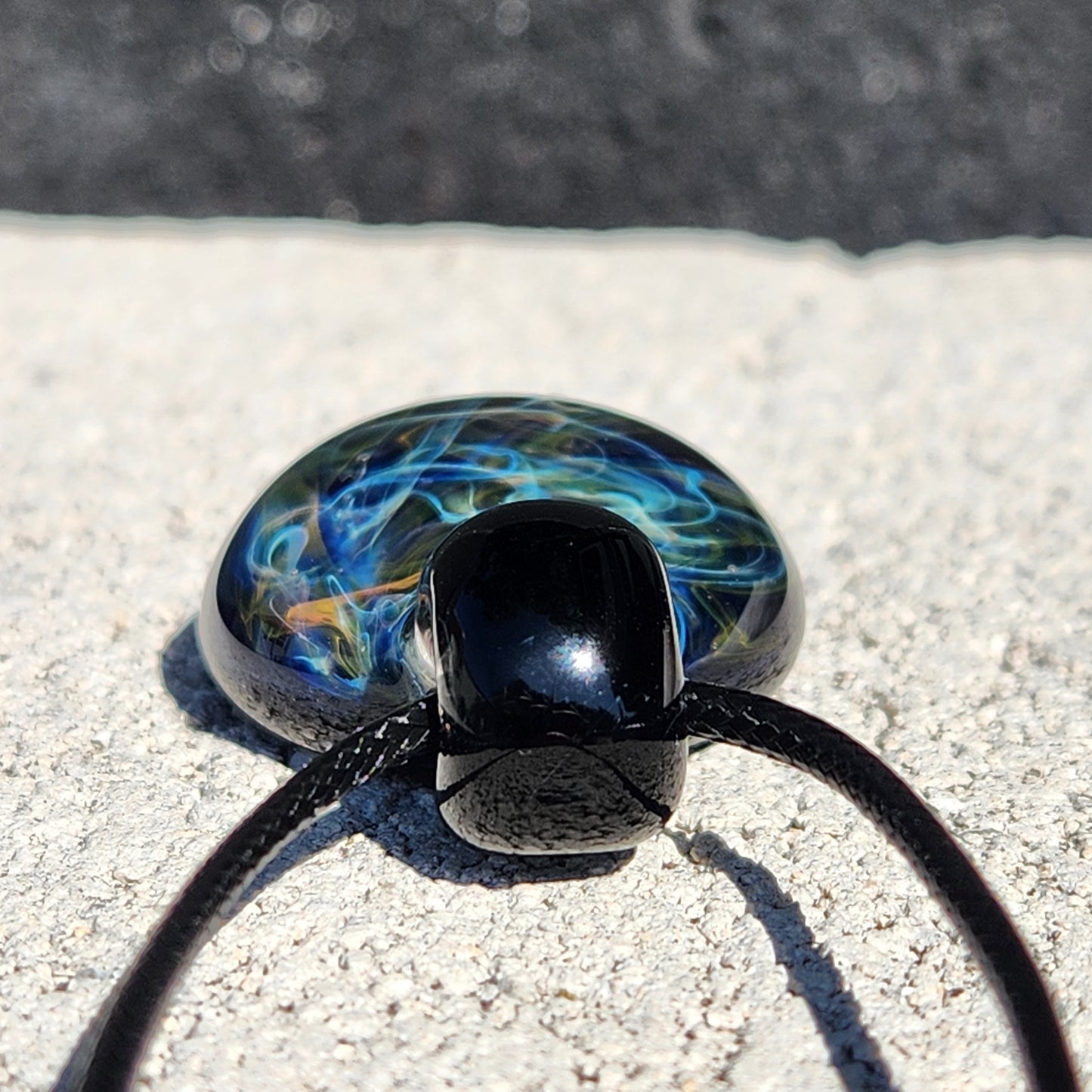 Gold & Silver Fumed Glass Pendant on Deep Blue Background