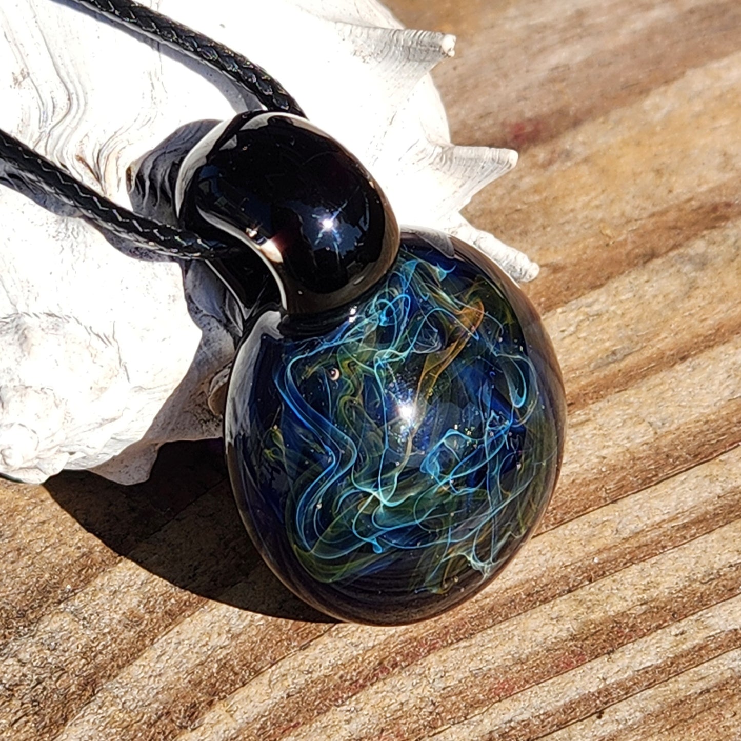 Gold & Silver Fumed Glass Pendant on Deep Blue Background