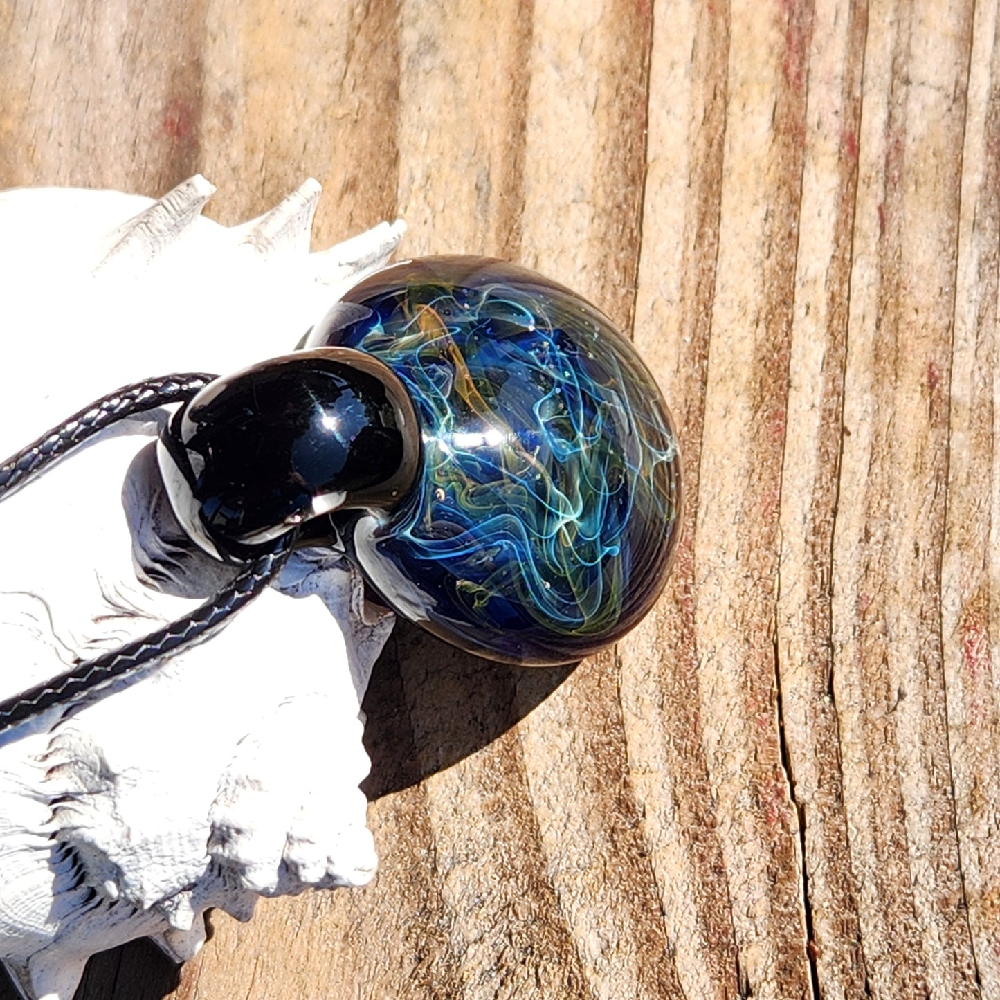 Gold & Silver Fumed Glass Pendant on Deep Blue Background