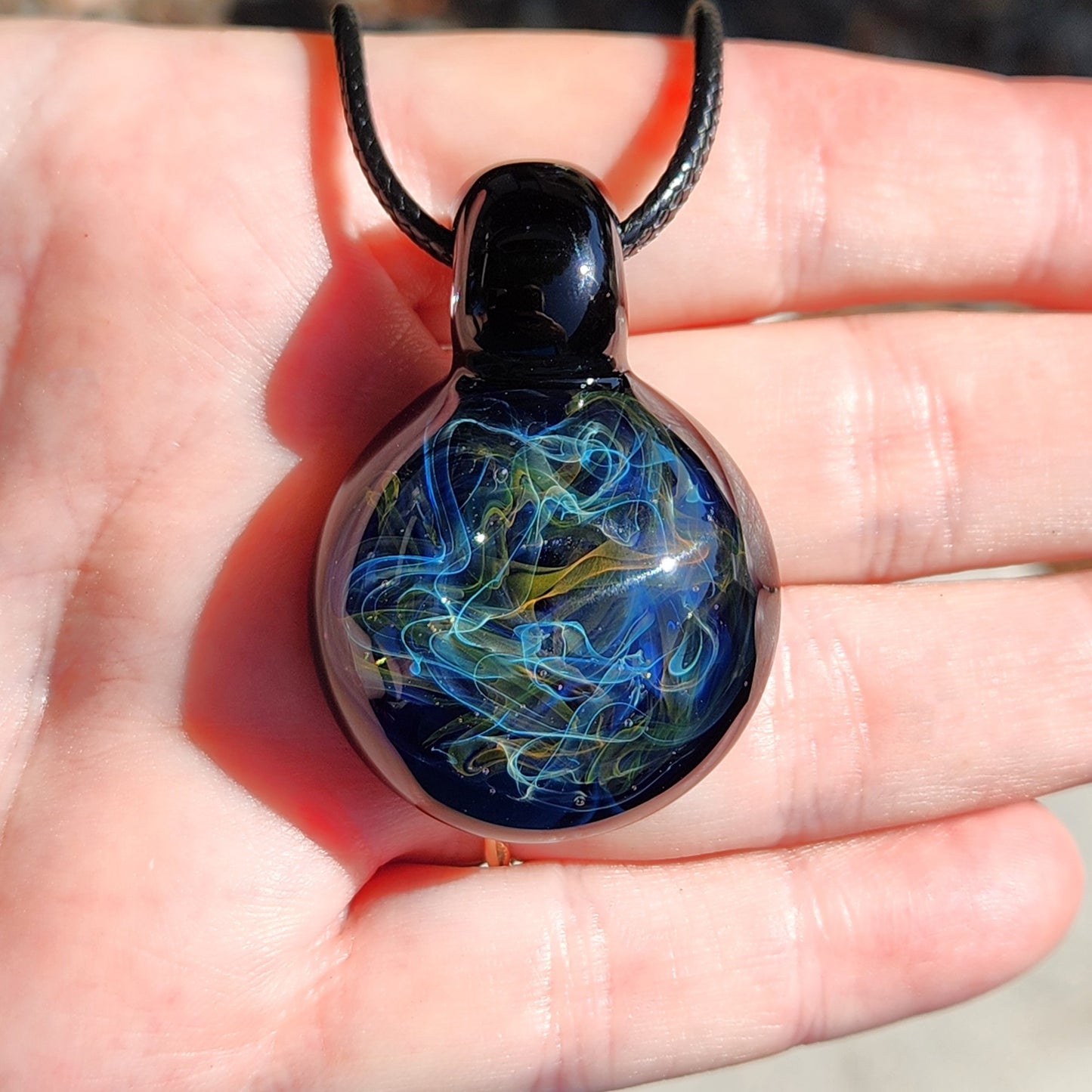 Gold & Silver Fumed Glass Pendant on Deep Blue Background