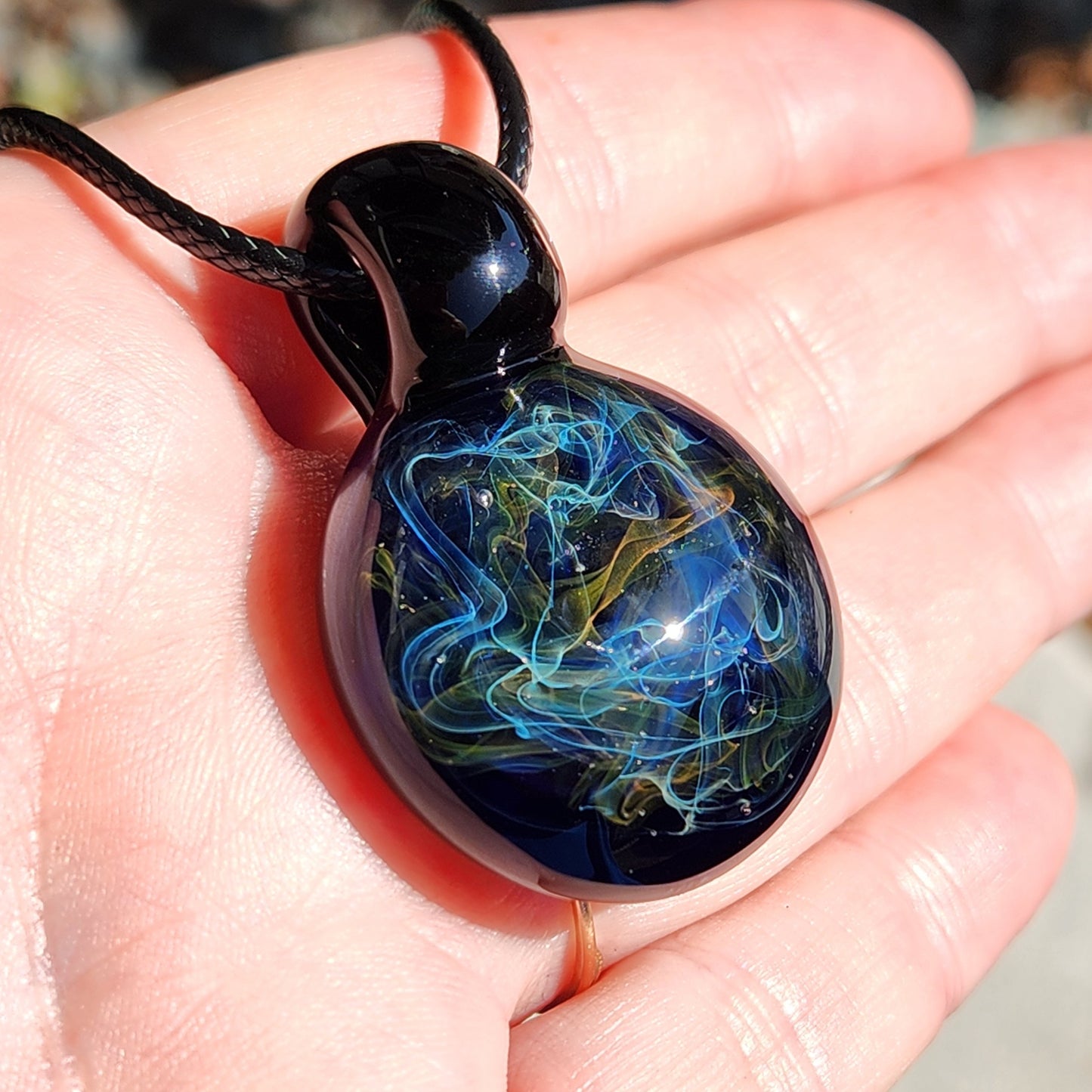 Gold & Silver Fumed Glass Pendant on Deep Blue Background