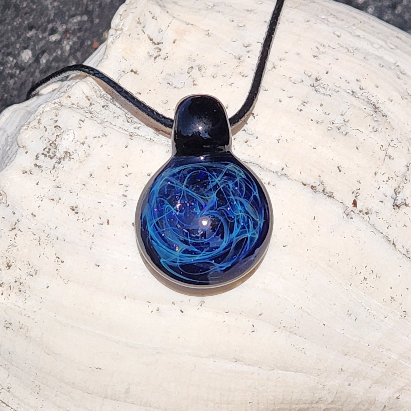 Black glass pendant necklace with blue electric web pattern, handmade artisan jewelry, on adjustable cord, gift boxed