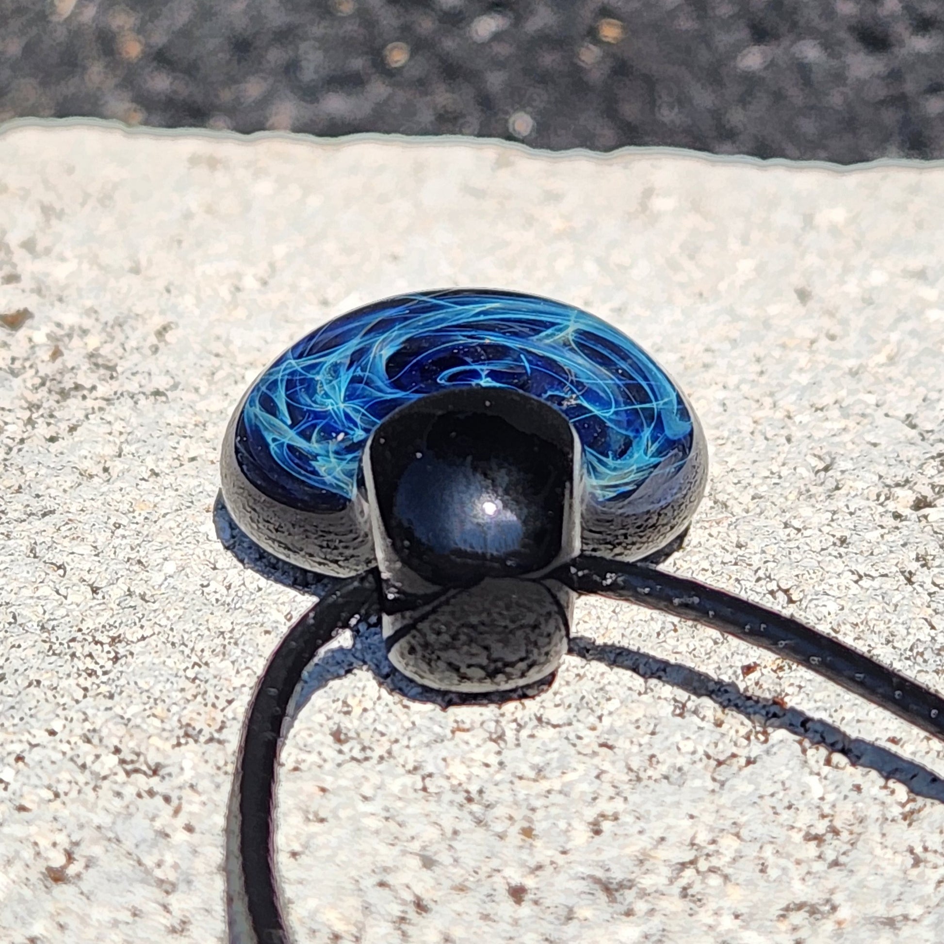 Blue electric swirl pattern on black glass pendant, handmade artisan jewelry on adjustable cord, gift boxed