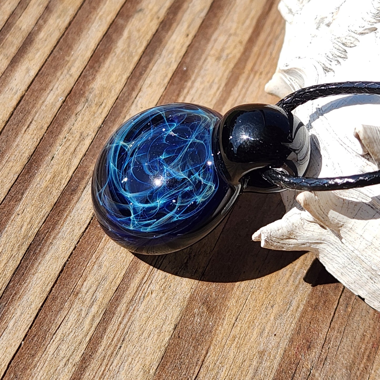 Black glass pendant with blue electric web pattern, artisan handmade jewelry, on adjustable cord, gift box