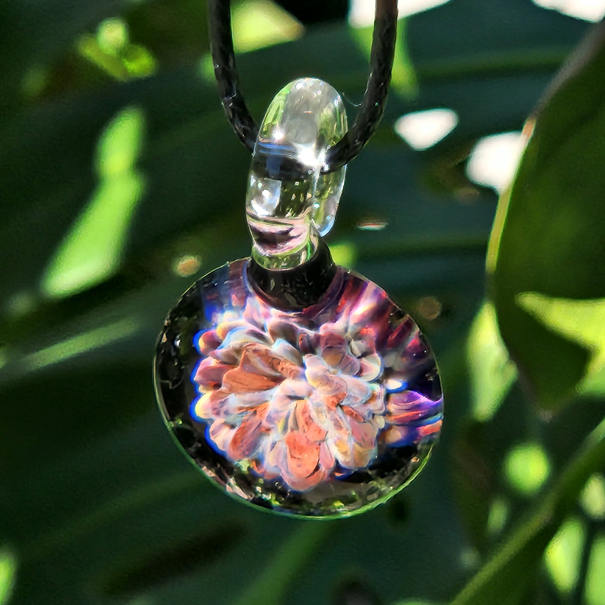 Brightly colored floral pattern glass pendant on black cord, handmade jewelry, small size, perfect for gift or personal wear