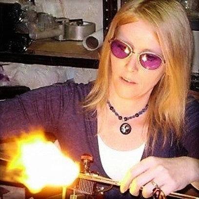 Anna blowing glass using a torch with propane and oxygen